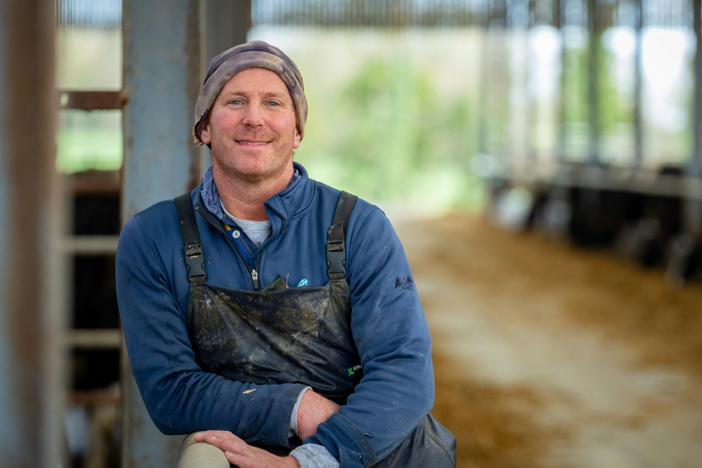 Farmer standing in shed