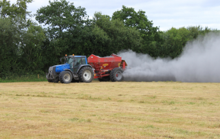 tractor spreading agri lime to silage ground