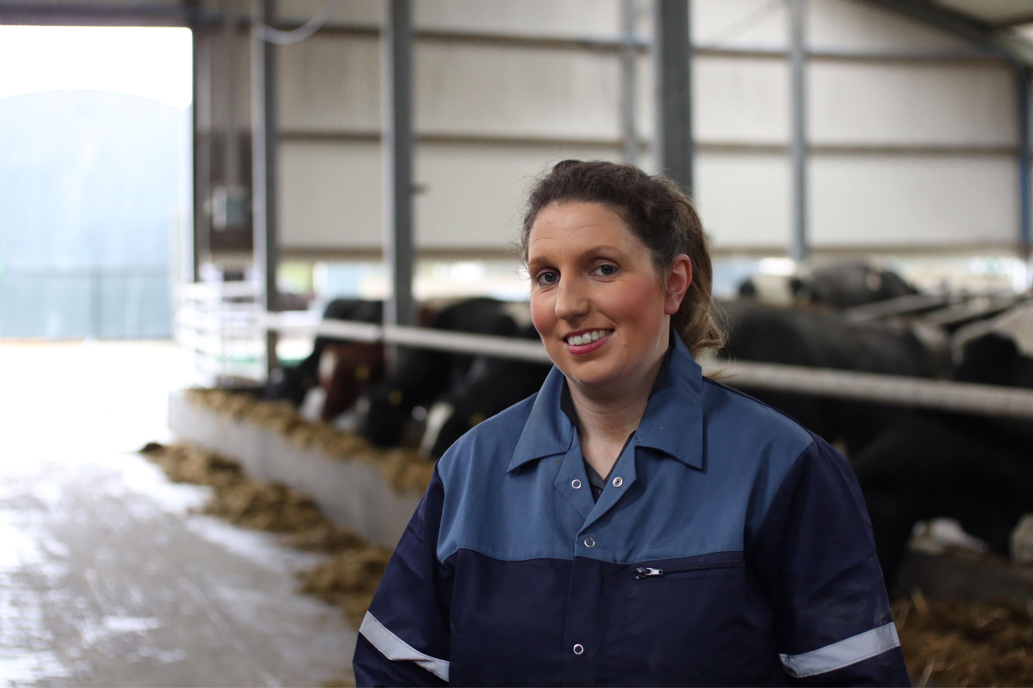 Farmer standing in shed