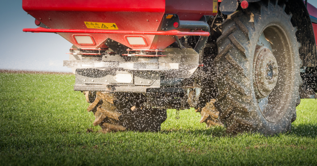 Fertiliser being spread onto grass